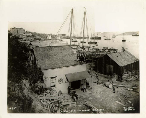 Black and white photo of old shipbuilding operation and San Francisco Bay.