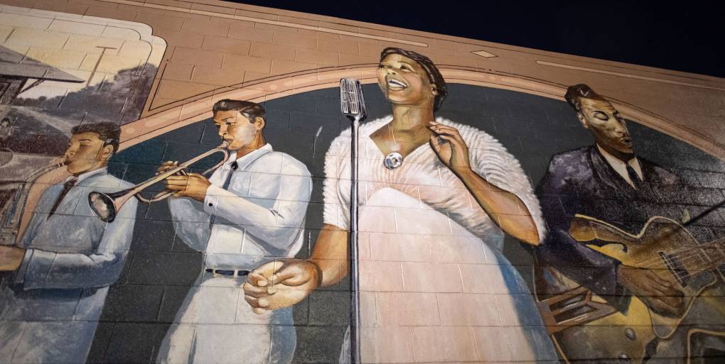 large outdoor mural showing renowned blues singer and band