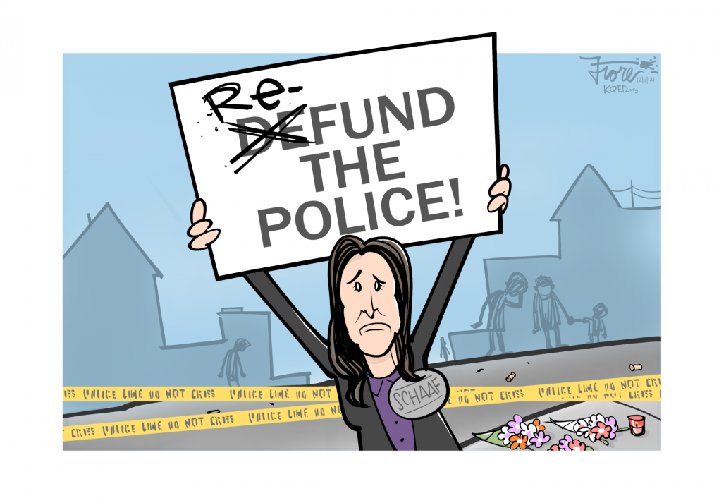 Cartoon: Oakland Mayor Libby Schaaf holds a sign that reads, "Defund the Police" with the "de" crossed out and replaced with "re." We see police tape, shell casings, a flower memorial and sad residents in the background.