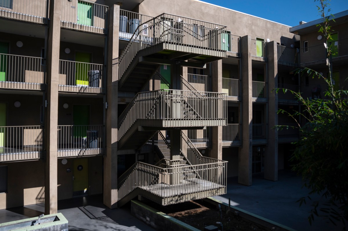 A wide shot of a multi-story residential structure.