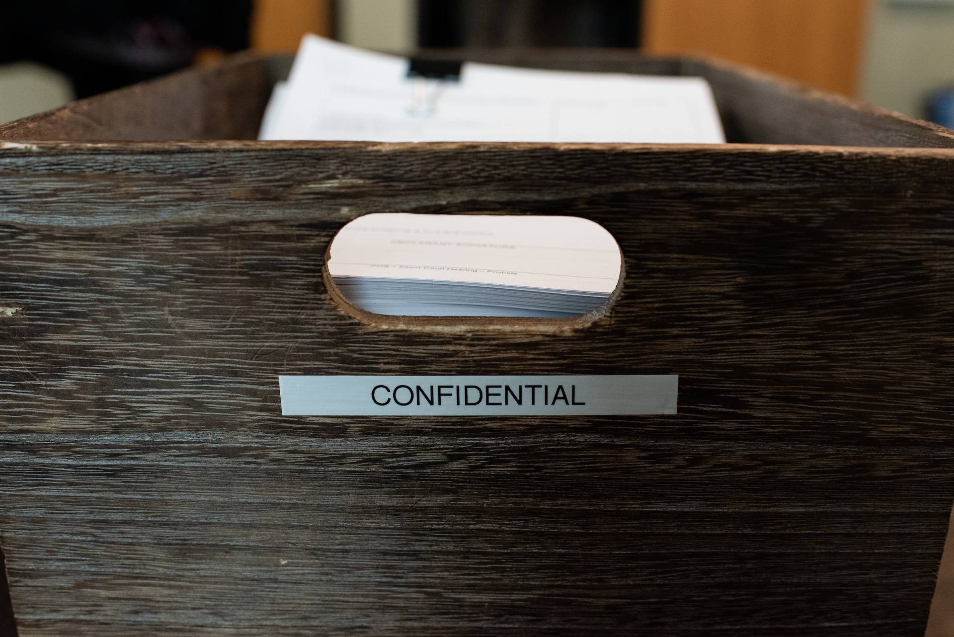 A box of papers that says "Confidential."