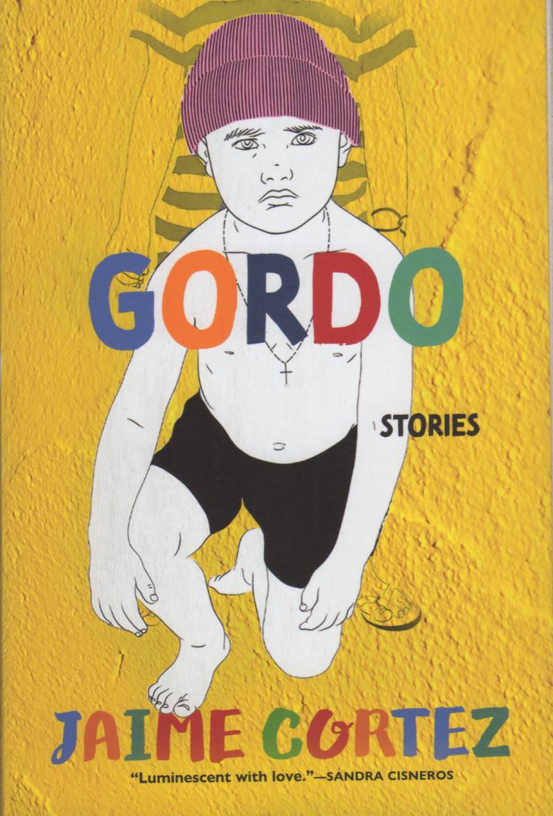 An illustration for a book cover with a small child wearing a knitted hat and necklace on one knee with the word "Gordo" across his chest.