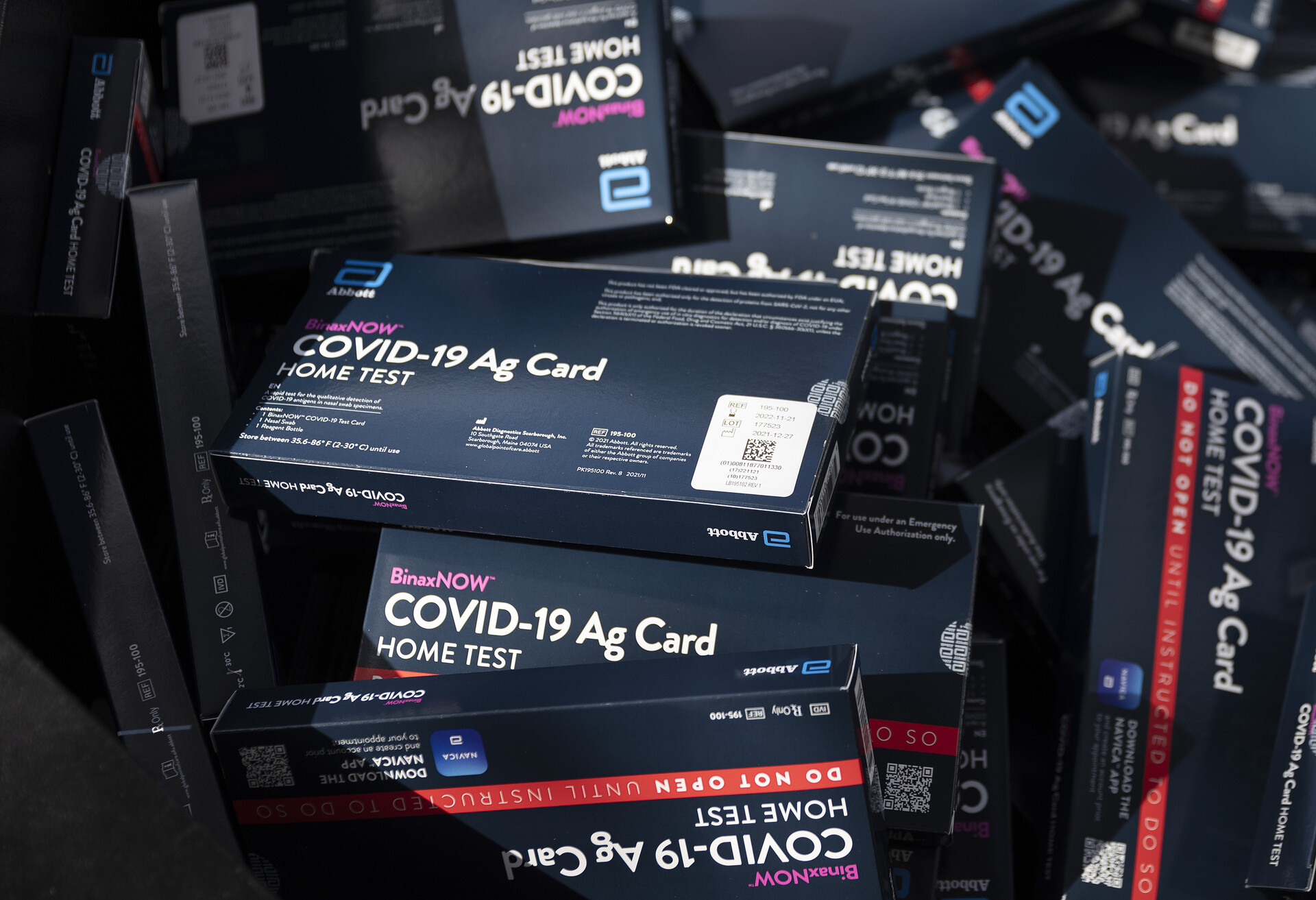 close up shot of boxes of COVID at-home test kits
