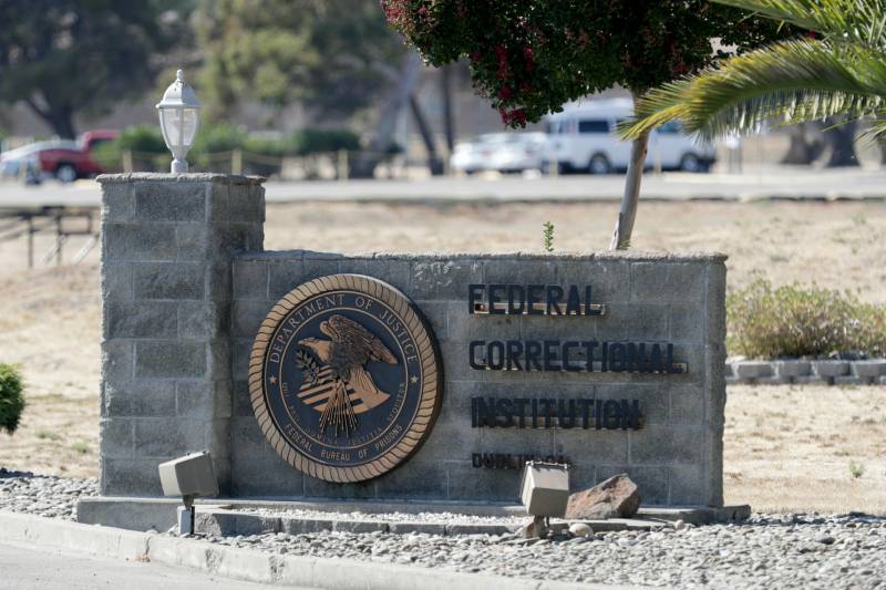 A depressing stone sign marks the entrance to the Dublin Federal Correctional Institution