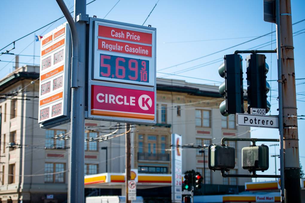 A sign shows prices at $5.69 a gallon for regular gasoline.