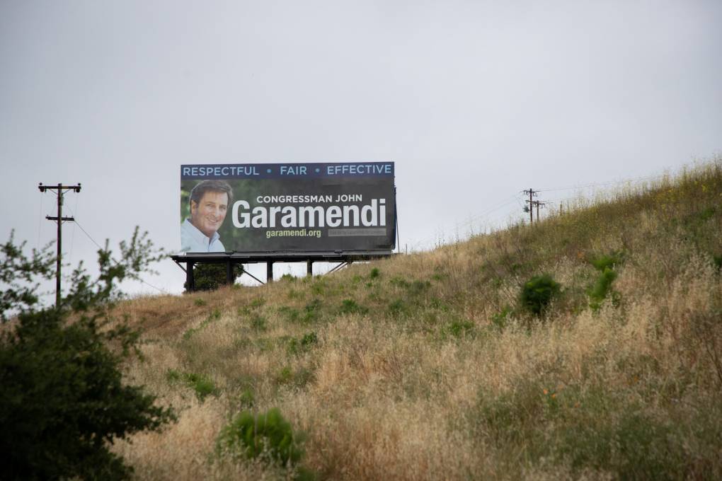 A billboard alongside a highway that says "Respectful. Fair. Effective. Congressman John Garamendi"