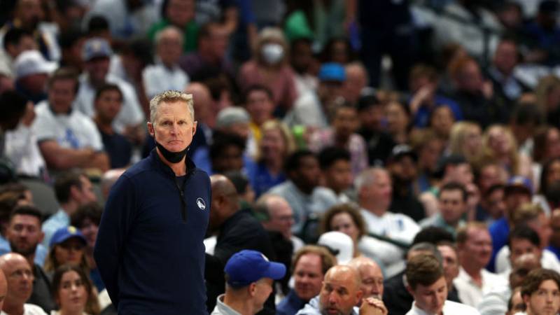 Golden State Warriors basketball coach Steve Kerr stands on the sidelines during a game.