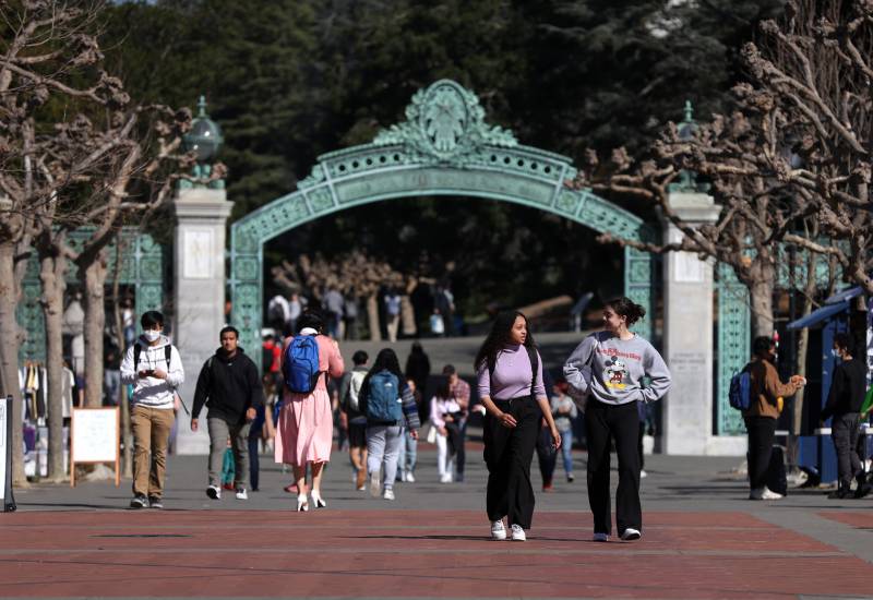 students walk through a plaza at UC Berkeley