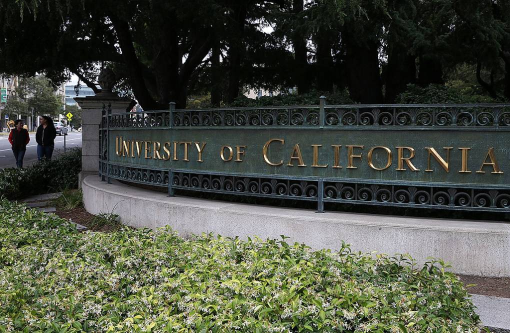 A metal sign that reads "University of California."