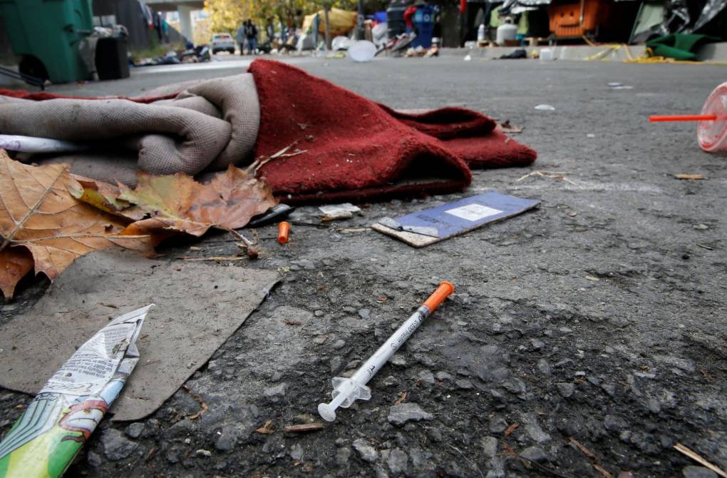 A syringe is seen discarded near a homeless encampment along Berry St. south of Market Street in San Francisco, California, on Tuesday November 1, 2016.