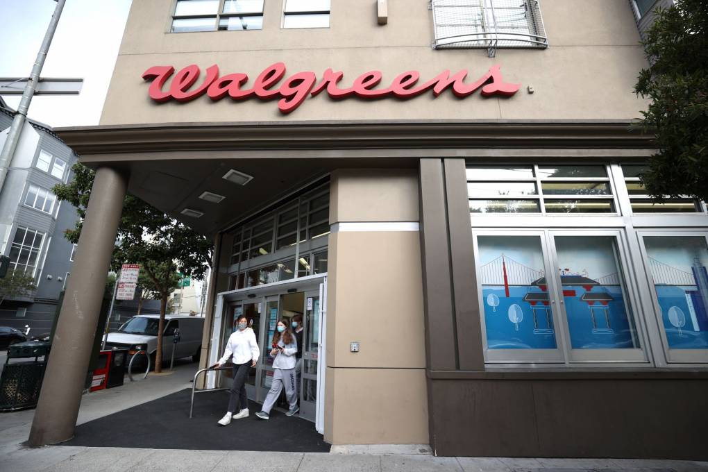 Customers leave a San Francisco Walgreens store on October 13, 2021.