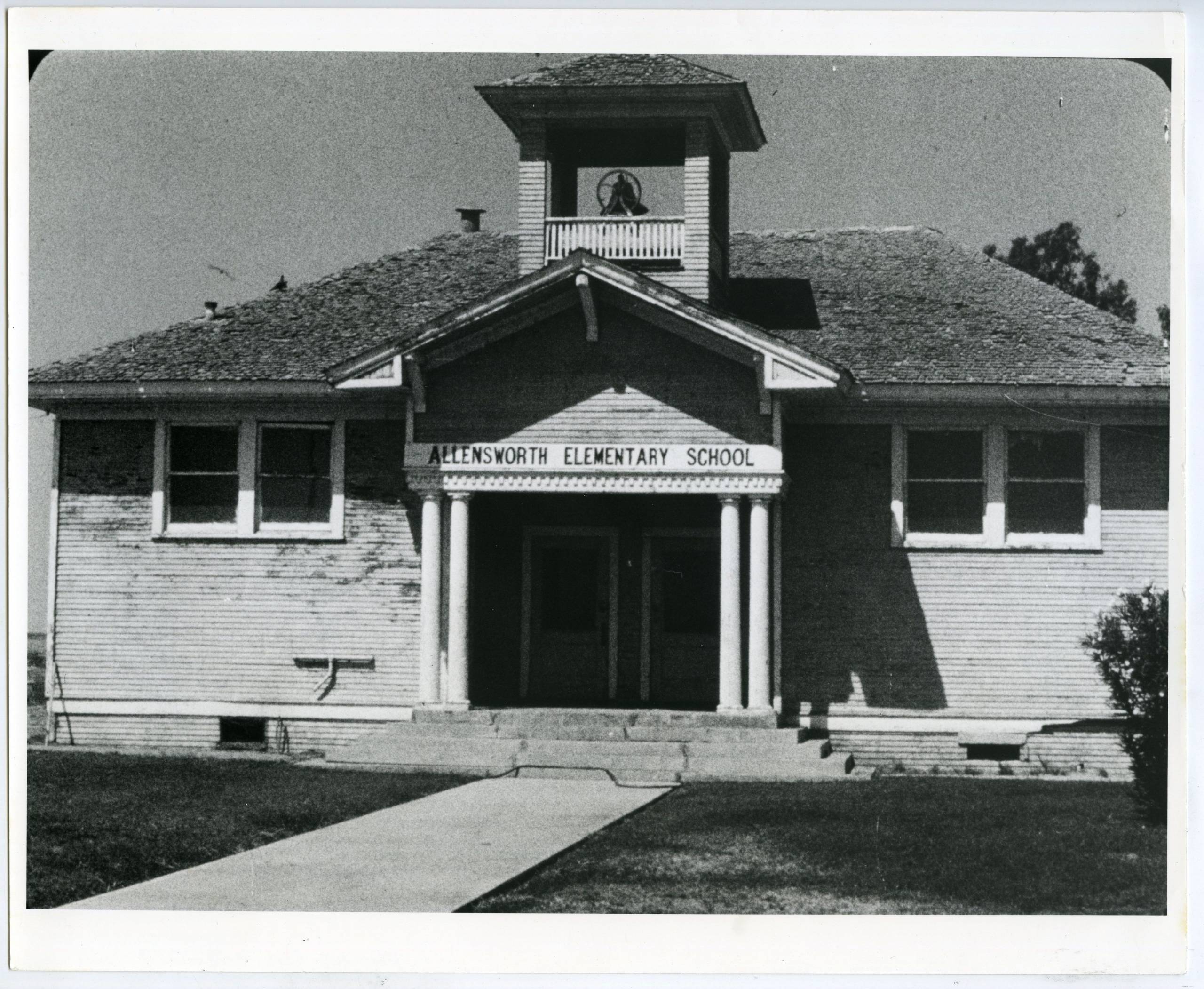 a black and white photo of a schoolhouse