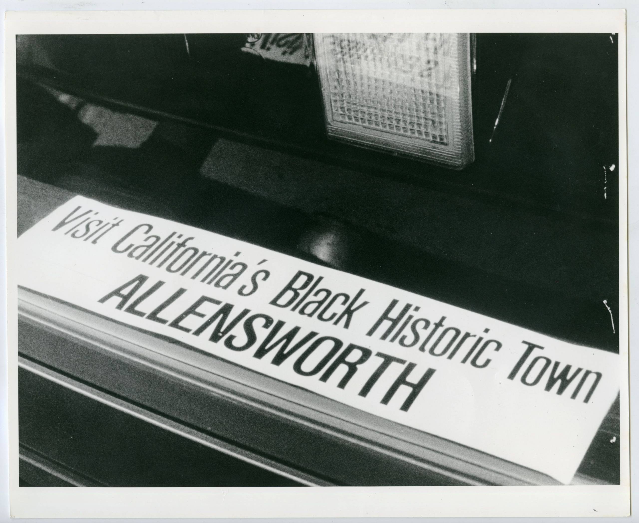 a bumper sticker that reads 'Visit California's Black Historic Town Allensworth'