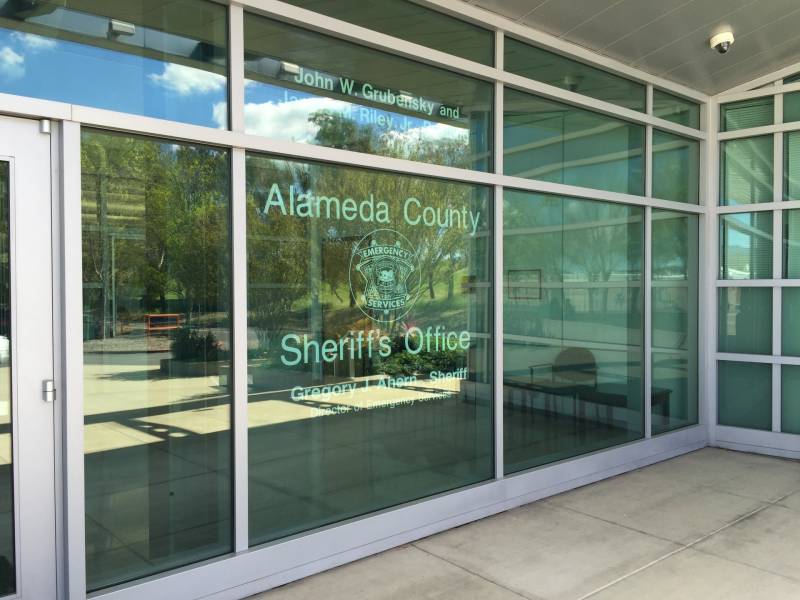 a glass-paned wall that reads 'Alameda County Sheriff's Office'