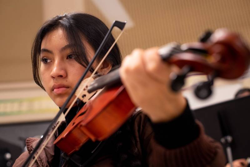 A Latina high school junior plays violin.