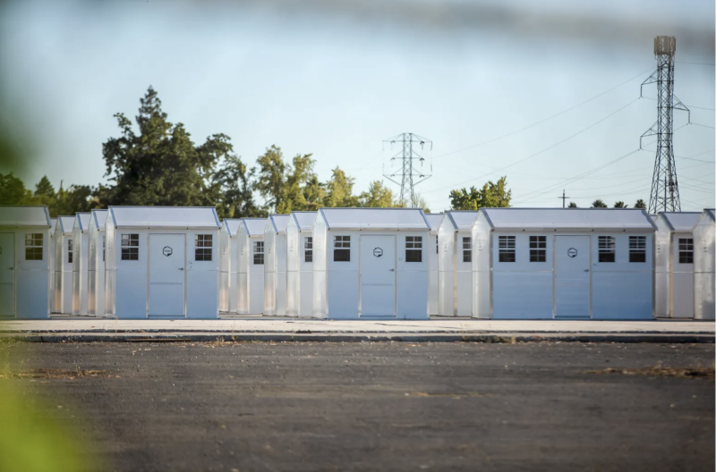 A row of small, white homes.