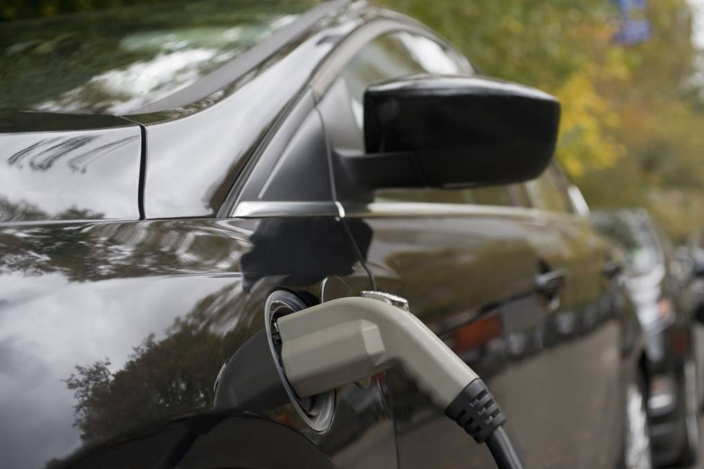 Charging an electric car, close-up