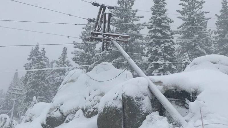 A downed power line covered in snow.