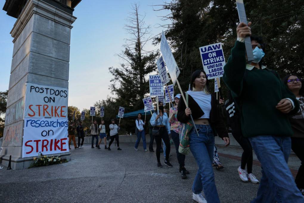 Students holding signs and placards demonstrate at UC Berkeley