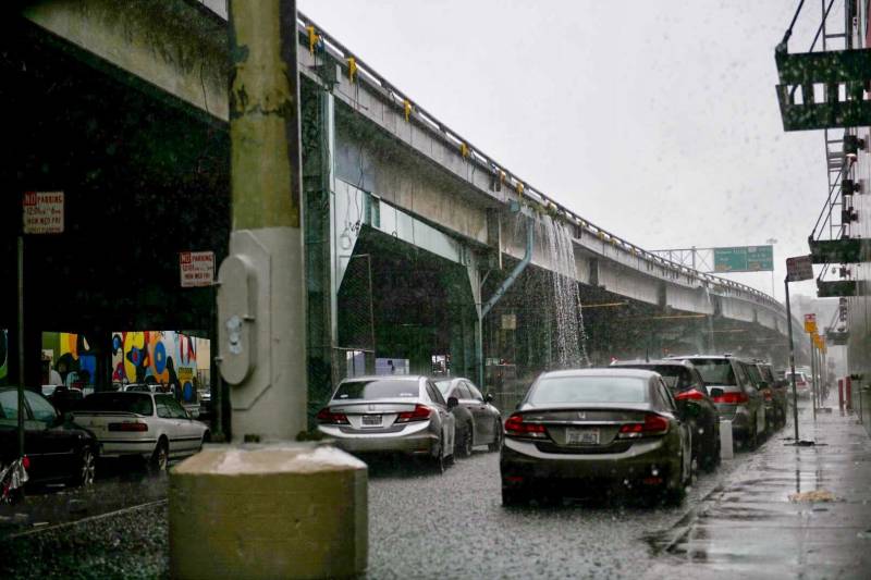 rain pours off an overpass on a stormy gray day in San Francisco