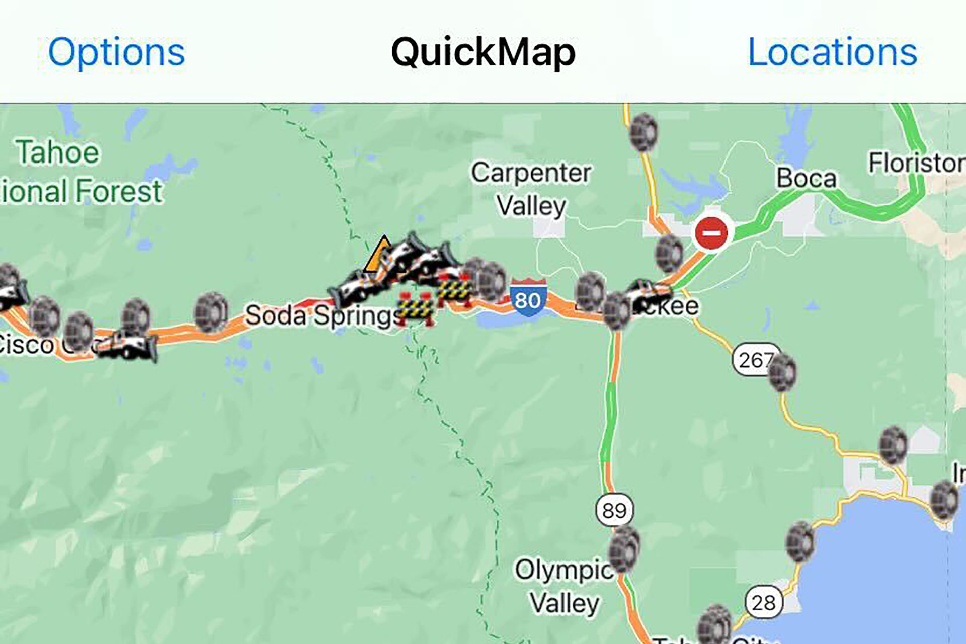 A screenshot of a graphical interface, with light green indicated earth, some blue indicating waterways, and a yellow line across it clustered with icons, as well as a blue-and-red award-shaped sign saying "80" to indicate the highway number.