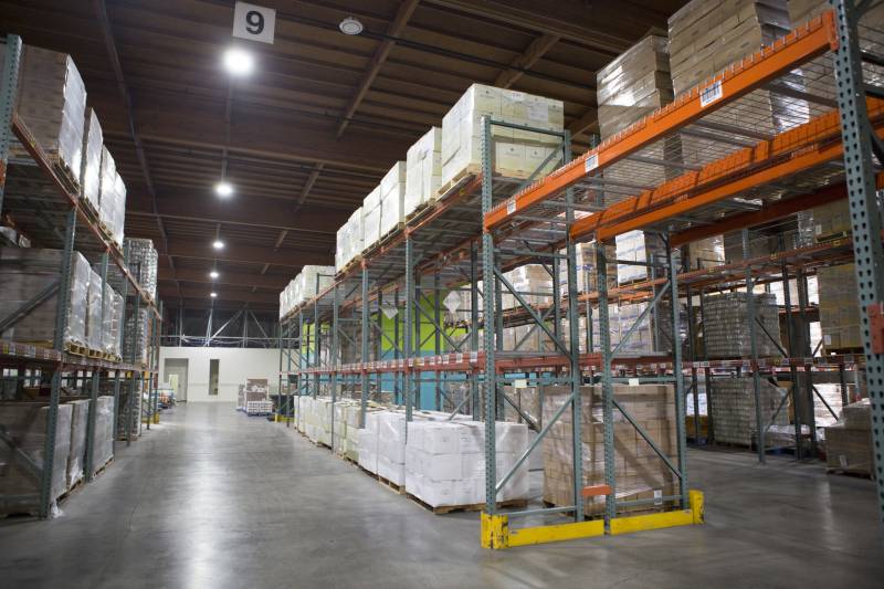 A warehouse with shelves of food.