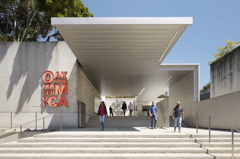 The exterior of the main entrance of the Oakland Museum of California, on a sunny day.