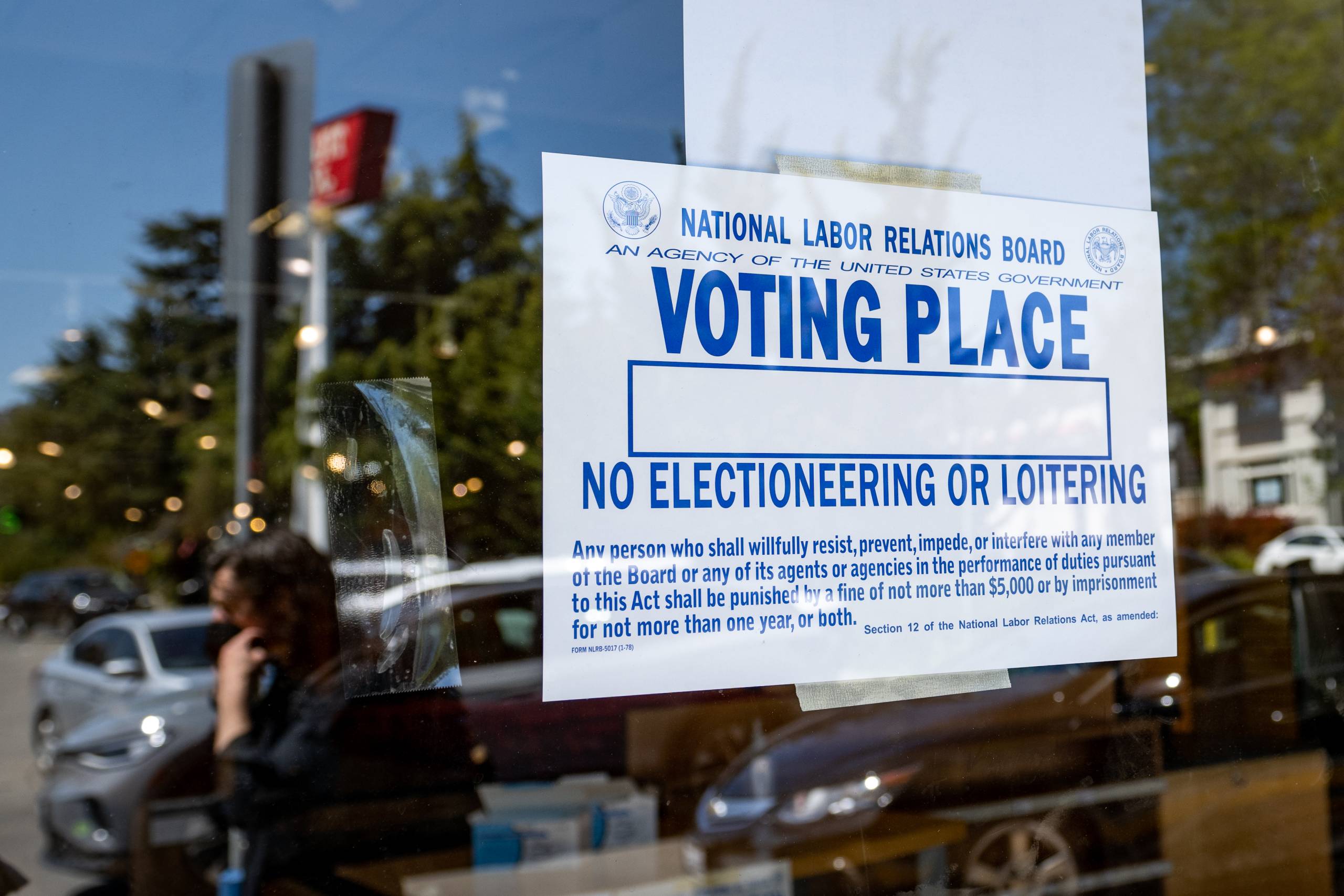 A sign up in a window that says "Voting Place"