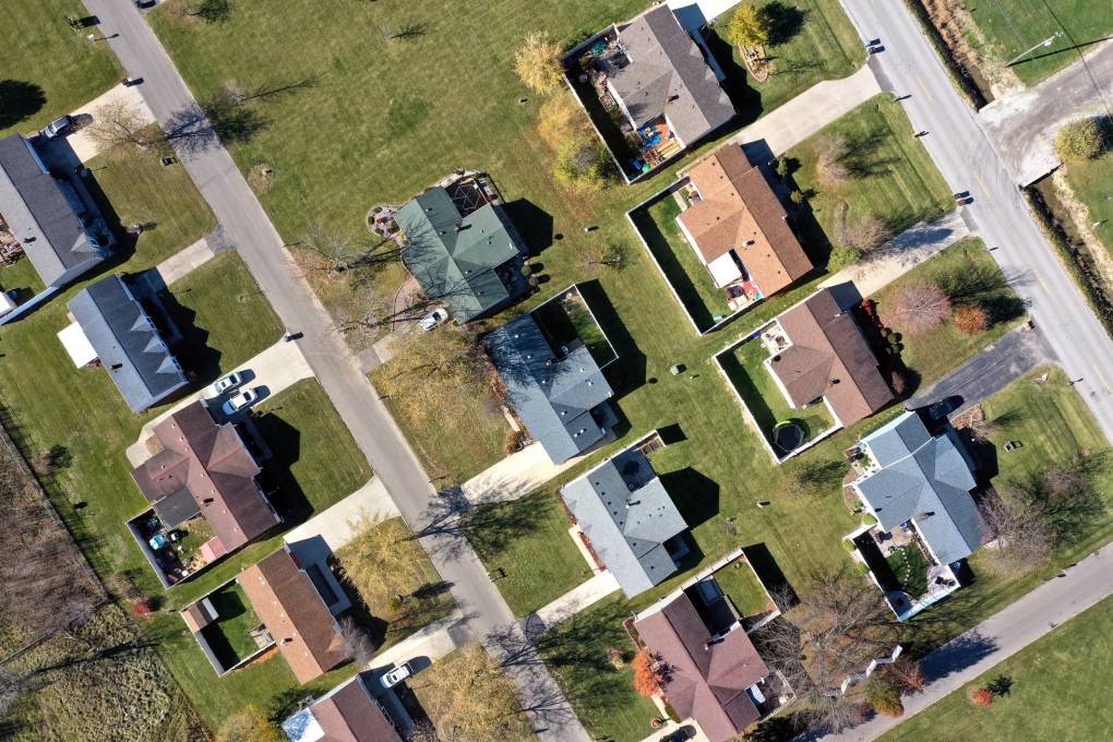 An aerial view of suburban houses.