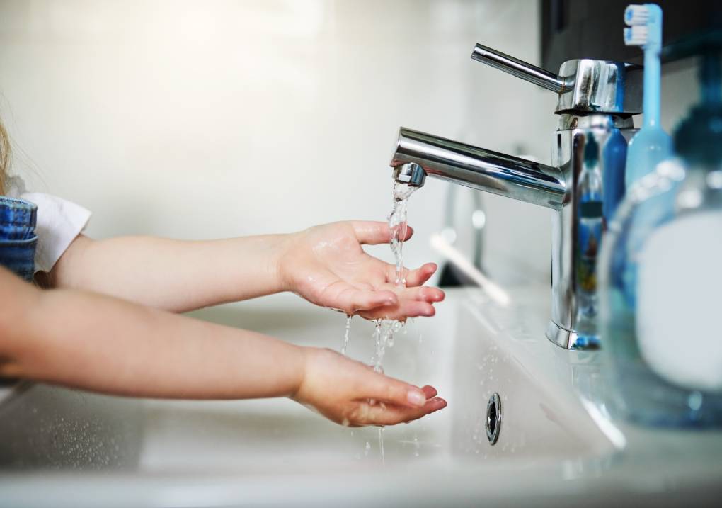 Cropped shot of an unrecognizable little girl washing her hands at home