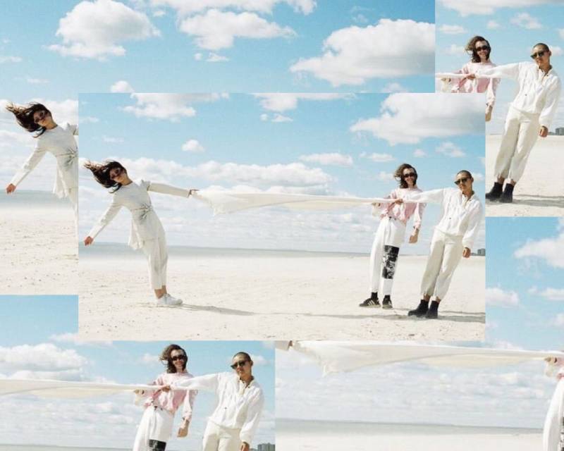 A collage of five photos of three people, all wearing white or light colored clothing and sun glasses. One person to the left hold on to a piece of clothing in her left hand while the other two people to the right hold the same piece of clothing in their right hands in the middle of a desert.