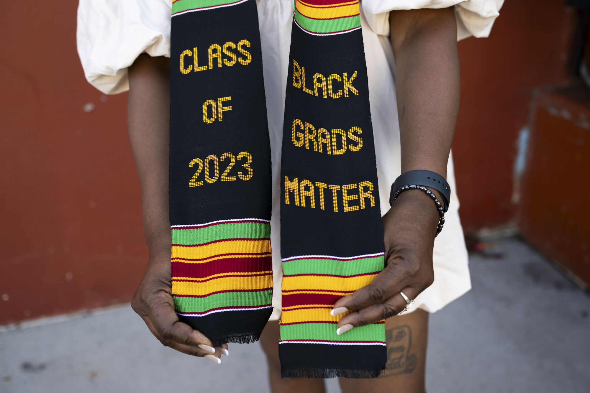 A black, green, yellow and red striped graduation stole with the words "Class of 2023" and "Black Grads Matter" written on it.