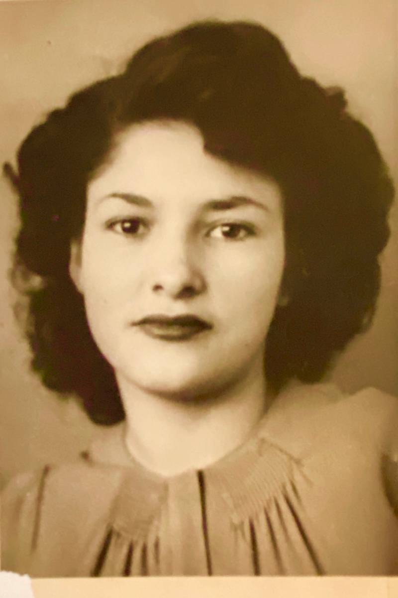 A vintage headshot of a Latina woman. 