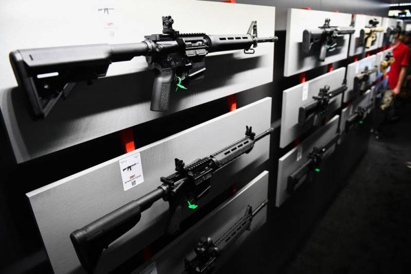 A wall of guns on display.