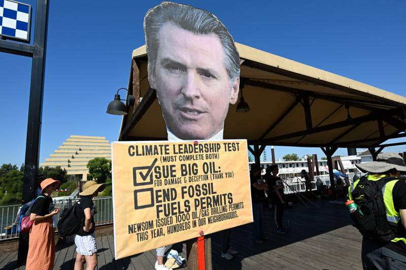 Governor Gavin Newsom's mock-up is seen as hundreds of climate change activists are gathered at Old Sacramento.