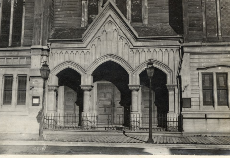 Black and white image of the front of a large stone church