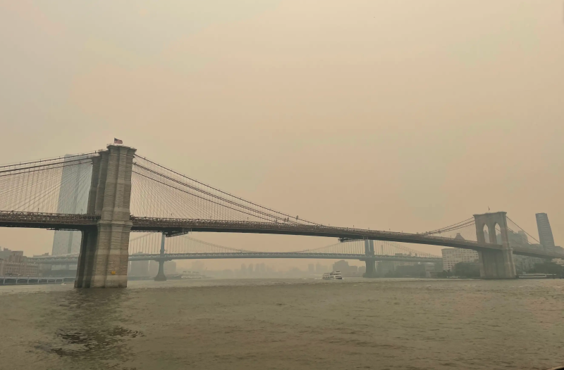 A hazy view of a bridge.