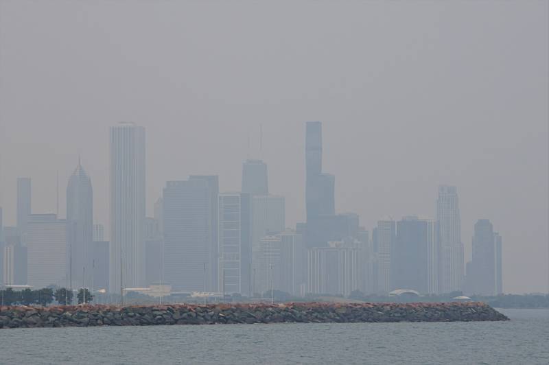 A hazy view of a city skyline.