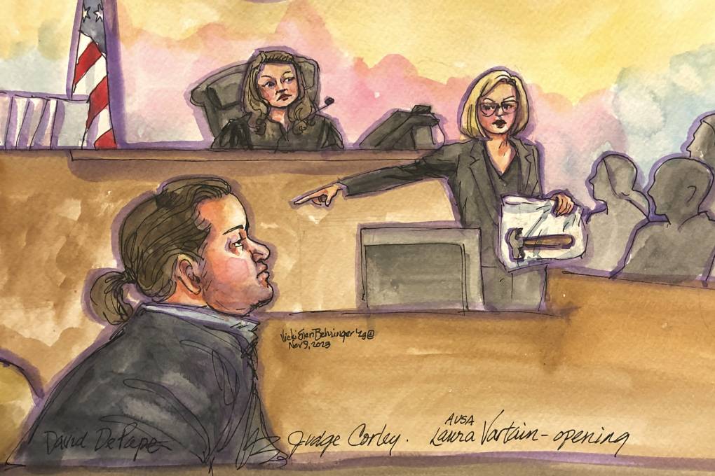 A courtroom sketch of a person with long hair holding a hammer in a plastic bag and pointing at another person as a judge and jury watch on.