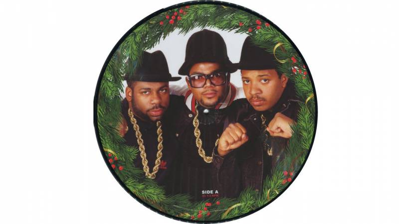 Run DMC pictured inside a Christmas wreath