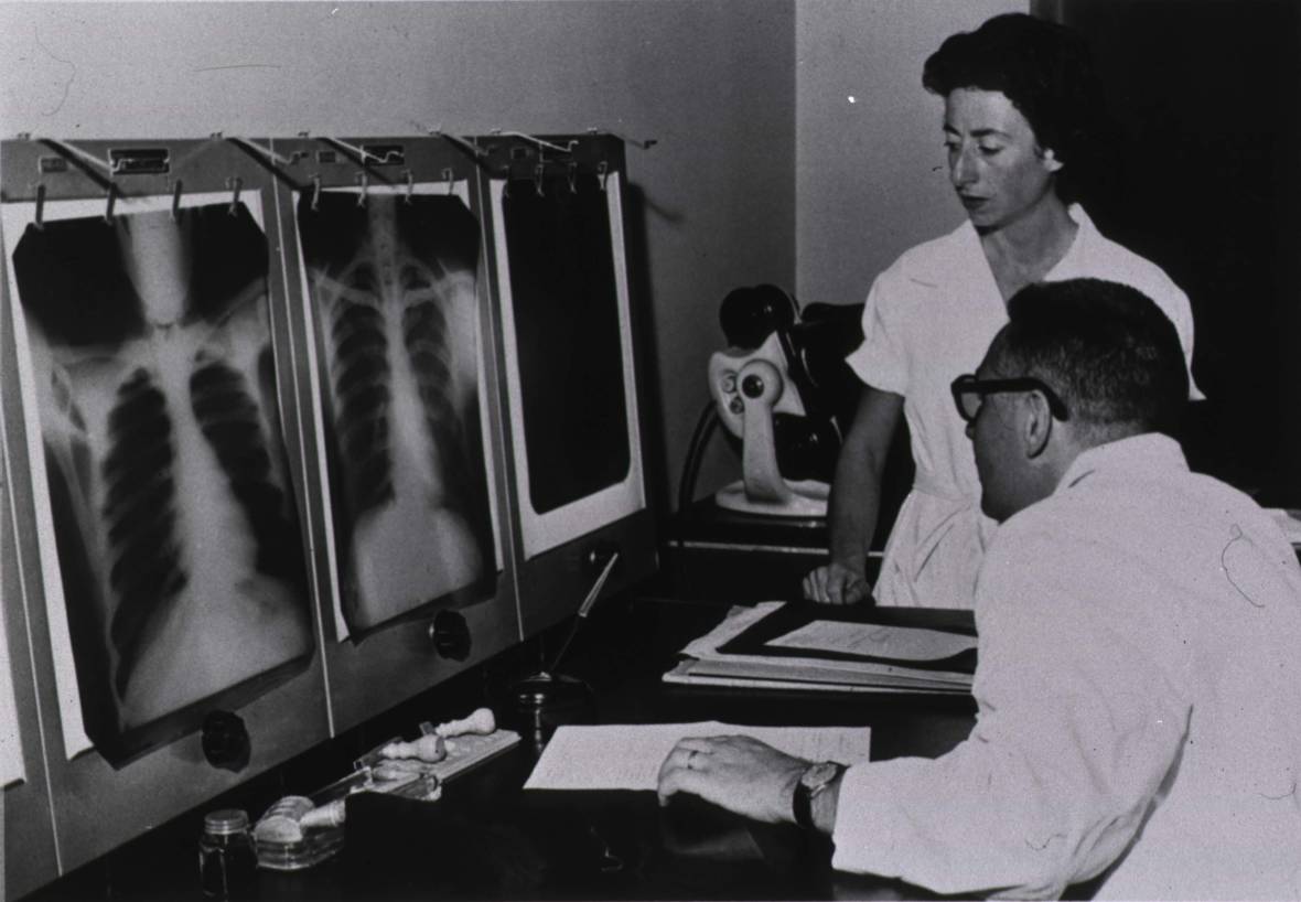 A doctor and nurse read X-ray films, circa 1959. From the History of the Public Health Service," Parklawn Conference Center, 1989