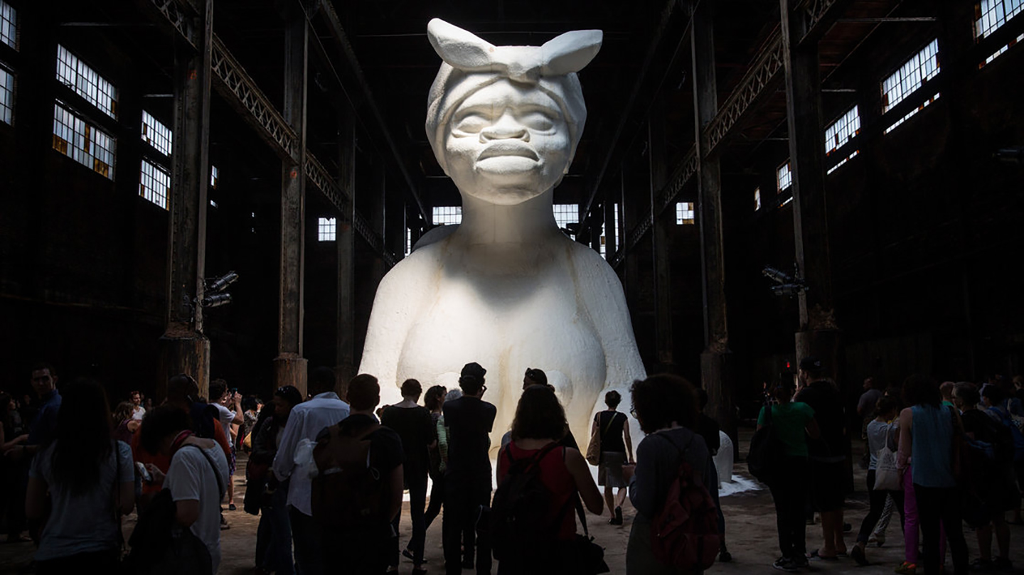 Viewers of Kara Walker's <em>A Subtlety</em> described the sculpture as "beautiful" and "the American sphinx." Another said, "She is so exposed and she's so vulnerable, but at the same time she has some grace and majesticness that is completely unapproachable." Andrew Burton/Getty Images