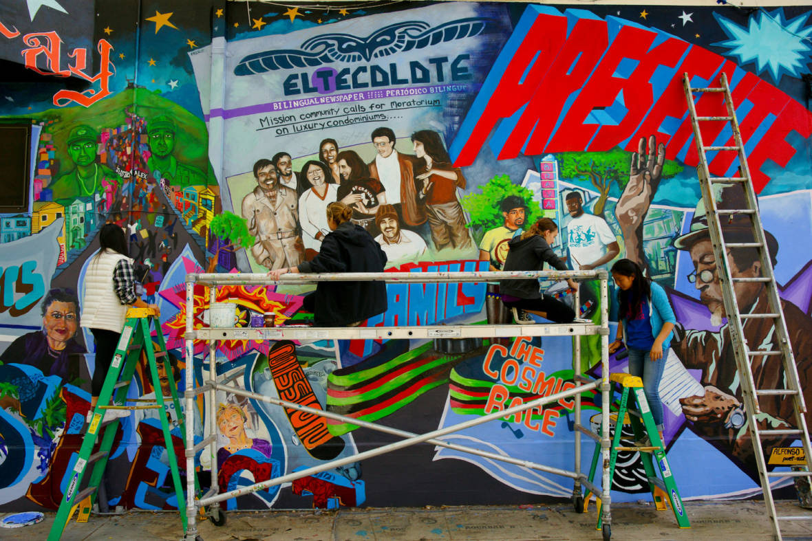 "This Place: A Tribute to the Mission Community," a 2015 mural by Precita Eyes muralists, photographed by Dick Evans.  Courtesy Dick Evans and Heyday Books