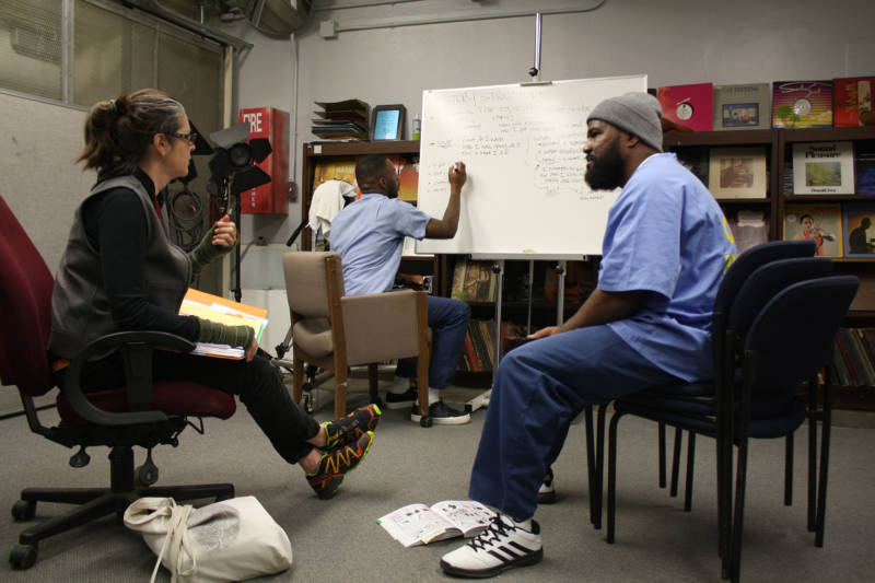 Nigel Poor, Antwan Williams and Earlonne Woods in a story pitch session at San Quentin, 2017.