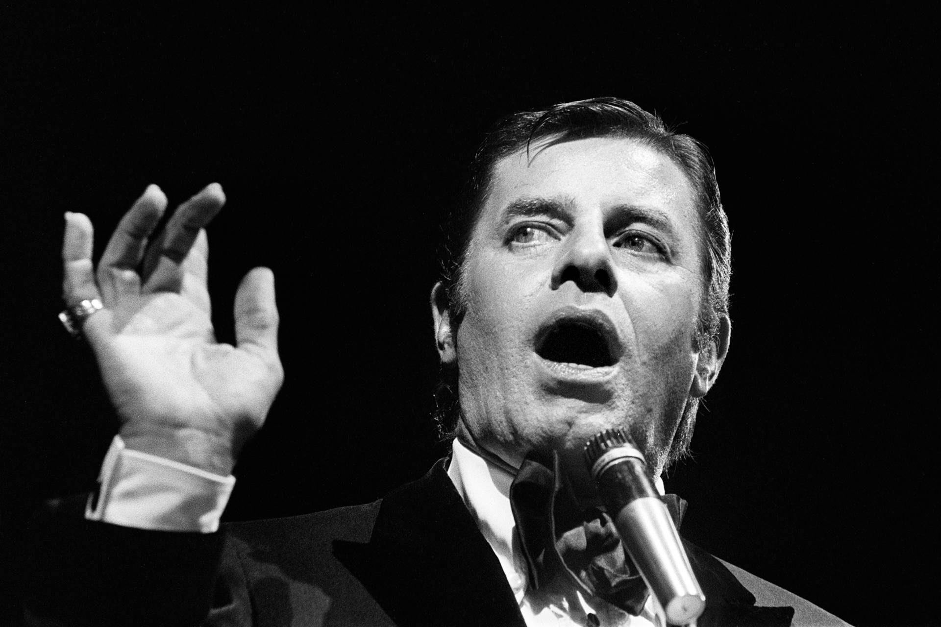 Jerry Lewis performs in Paris in 1976. Lewis, who appeared in dozens of films throughout his career, was perhaps nowhere more critically acclaimed than in France, where he earned the country's highest civilian honor. Photo: STF/AFP/Getty Images