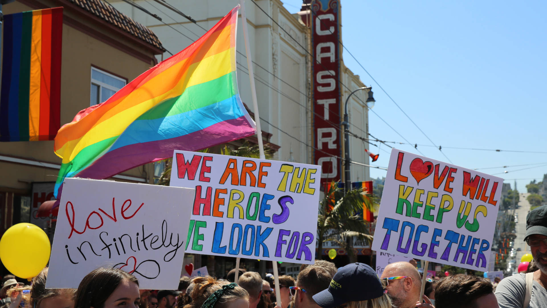 Signs at the Come Together rally in San Francisco's Castro District