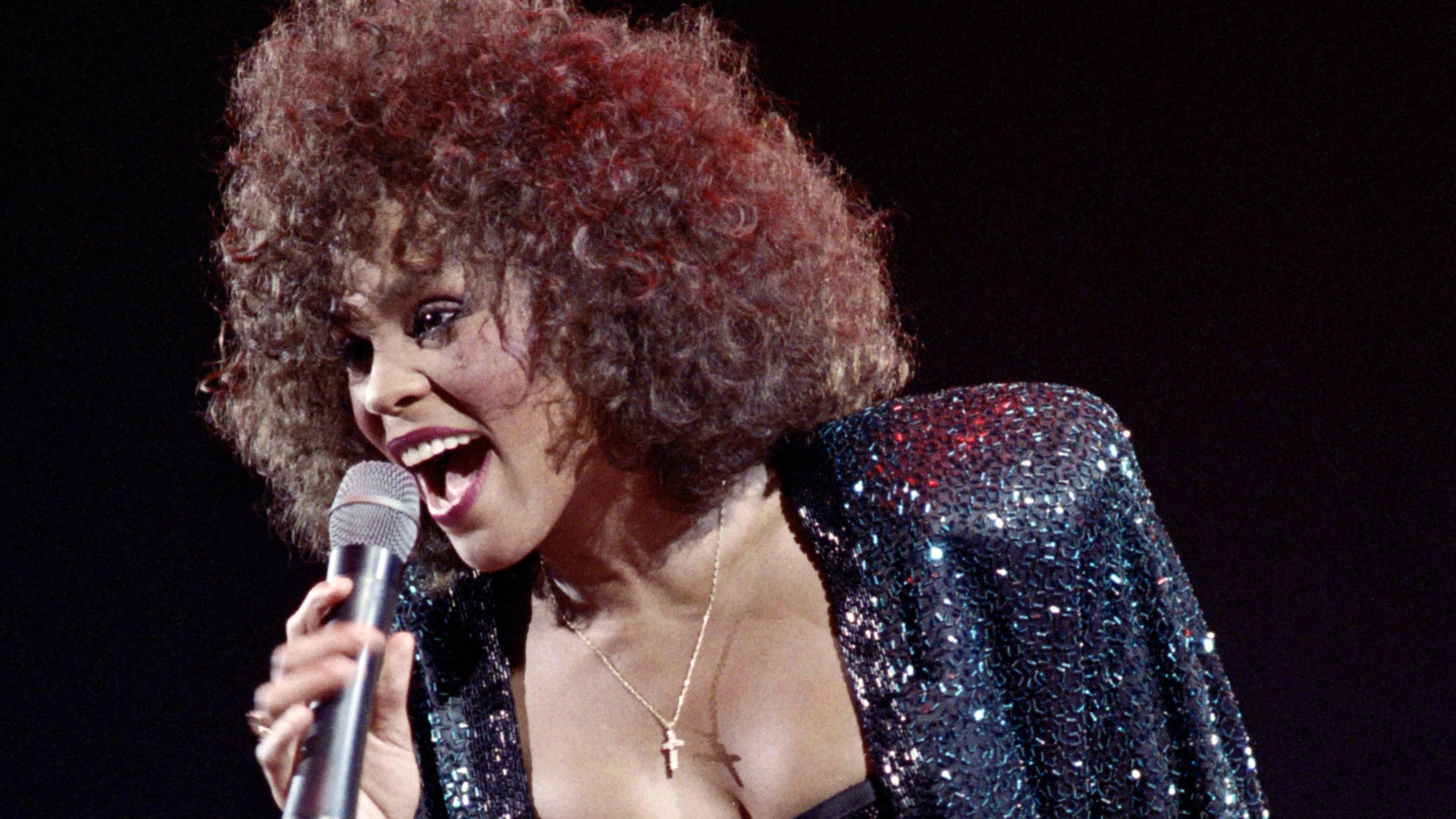 Whitney Houston performs in 1988. The new Showtime documentary, Whitney: Can I Be Me, includes footage of her world tour in 1999. Photo: Bertrand Guay/AFP/Getty Images