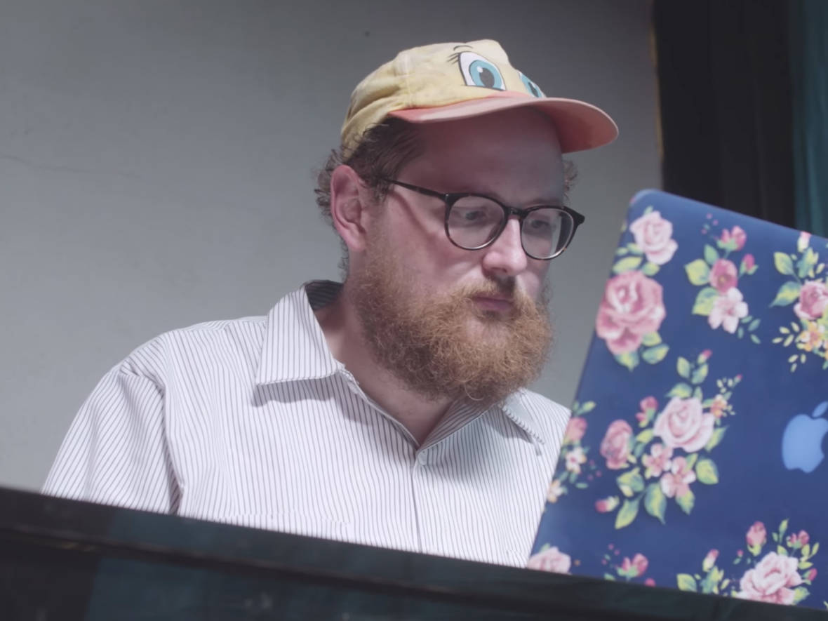 Dan Deacon works at his computer while scoring 'Rat Film' Domino Recording Co/Screenshot by NPR