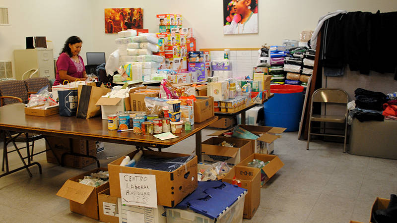 A volunteer organizes supplies for fire evacuees at radio station KBBF's donation center in Santa Rosa in 2017. 