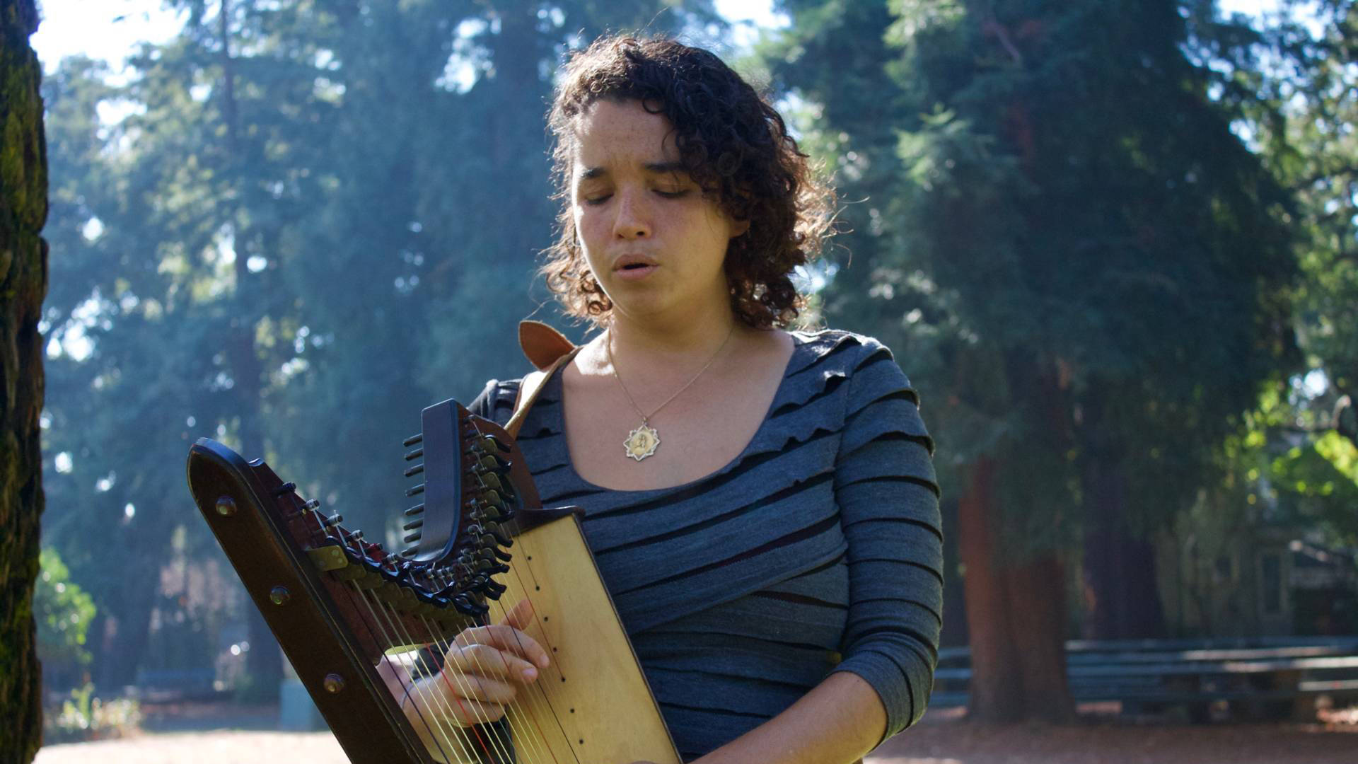 María José Montijo plays her harp at Dimond Park in Oakland. Audrey Garces